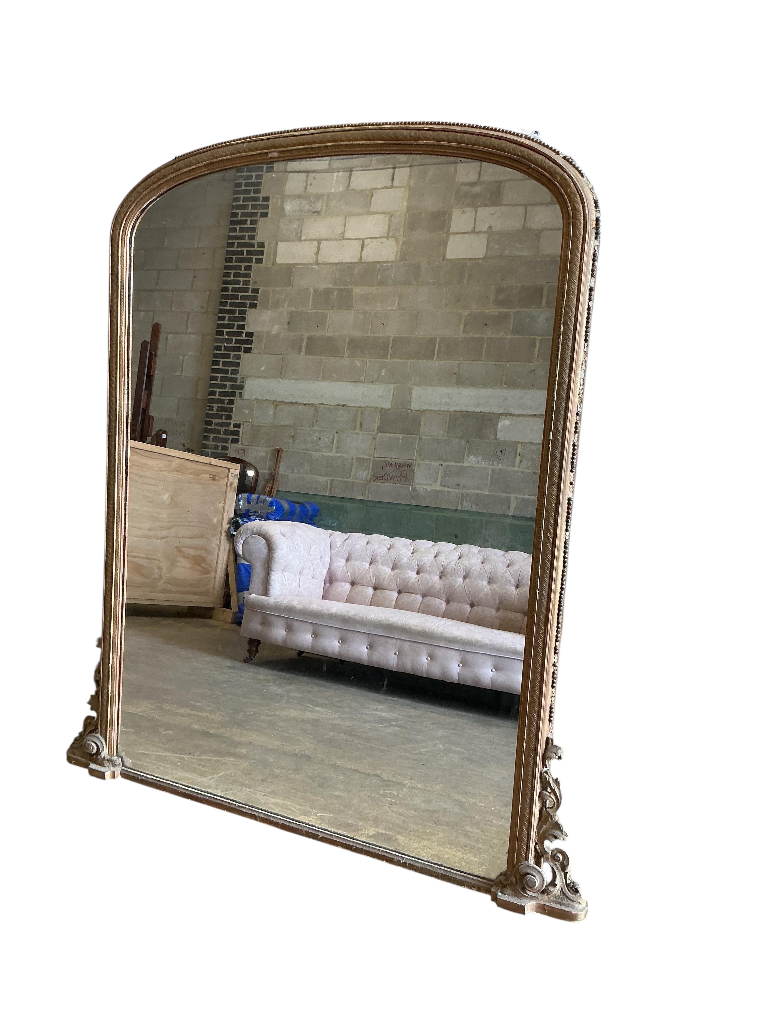 A large Victorian giltwood and composition overmantel mirror, width 160cm, height 184cm